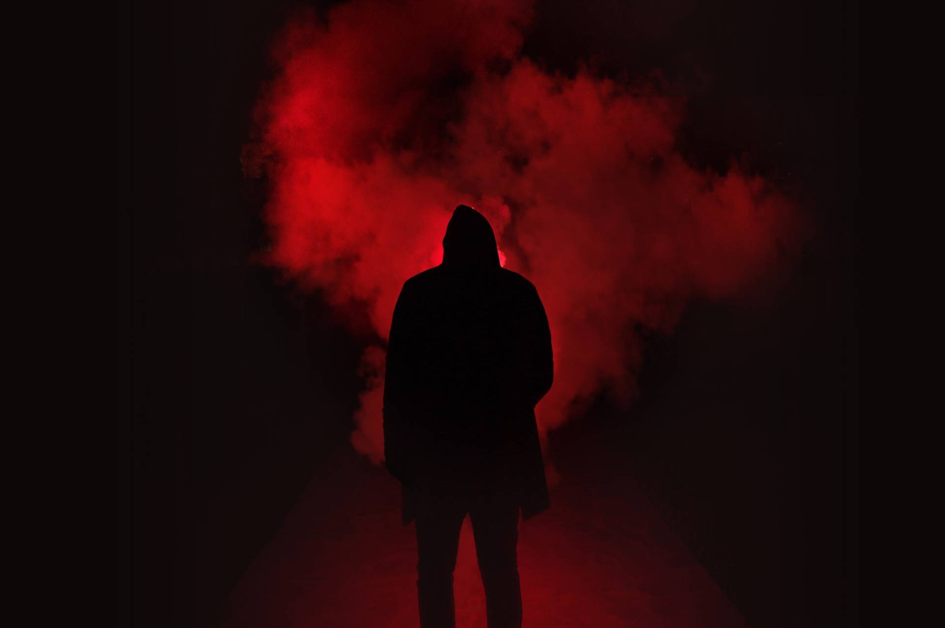 logline | silhouette of man standing against black and red background 333850 1