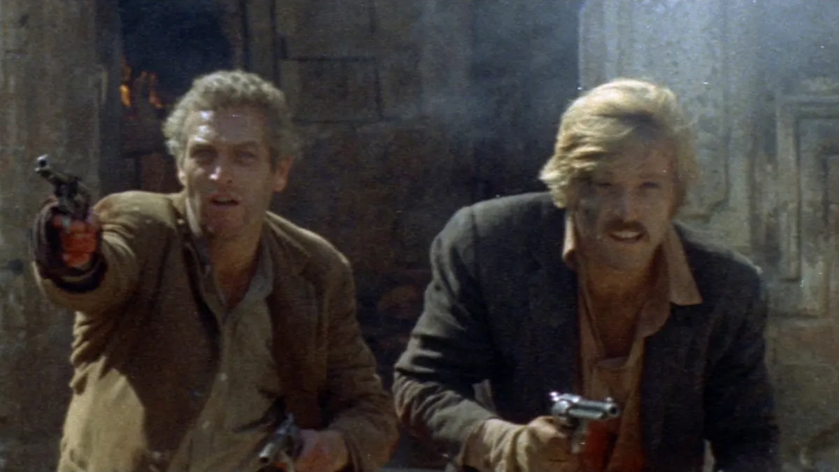 Butch Cassidy and the Sundance Kid draw their guns in Butch Cassidy and the Sundance Kid (1969)